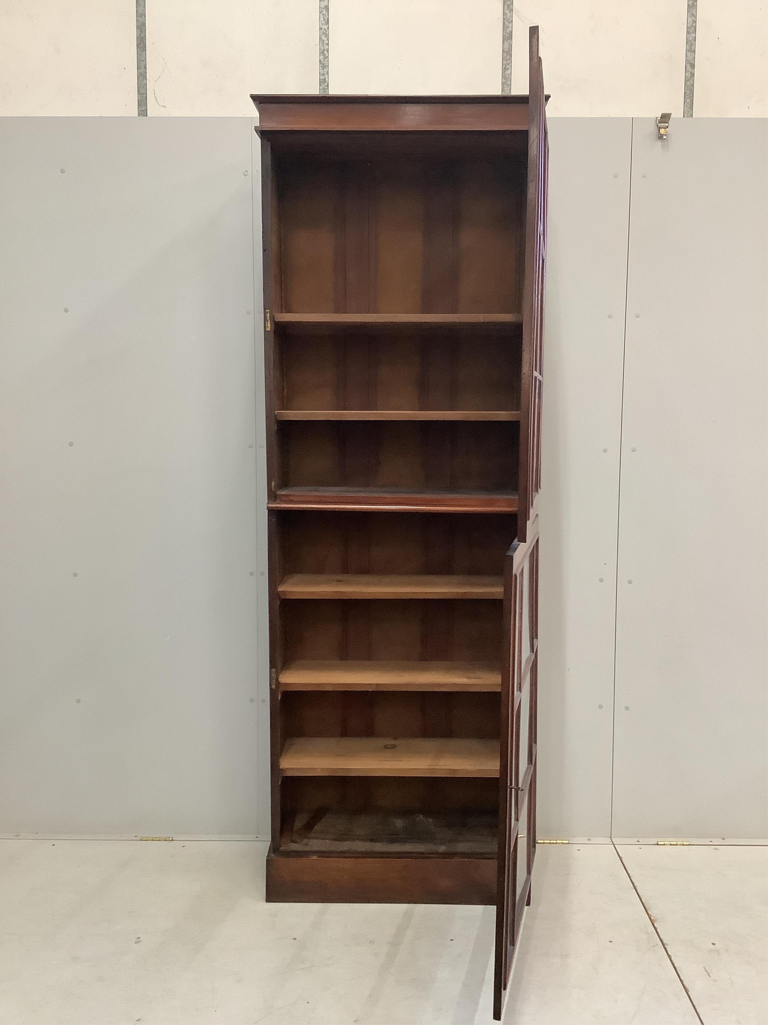 A Victorian mahogany narrow bookcase, width 76cm, depth 32cm, height 230cm. Condition - fair